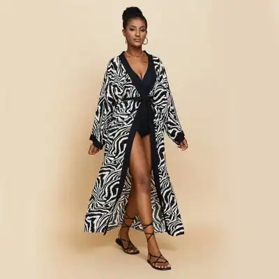 Stylish zebra print long kimono for women, perfect for trendy fashion and elegant occasions. Shop now for quality women’s clothing at Monalisa Store.