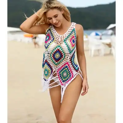 Vibrant crochet beach cover-up for women, ideal for summer beaches, pool parties, and vacation wear. Handmade with colorful yarns, offering a fashionable and lightweight addition to your swimwear wardrobe.