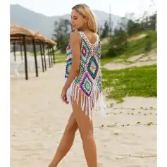 Bright, bohemian-style crochet beach dress with fringe, perfect for summer vacations and poolside lounging.
