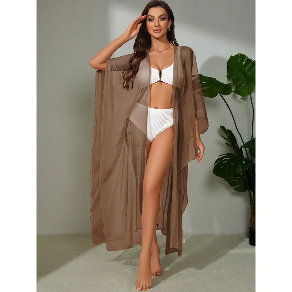 Stylish sheer brown mesh beach cover-up over white bikini, perfect for summer, pool, or beachwear. Lightweight, fashionable, and comfortable for women seeking swimwear accessories.