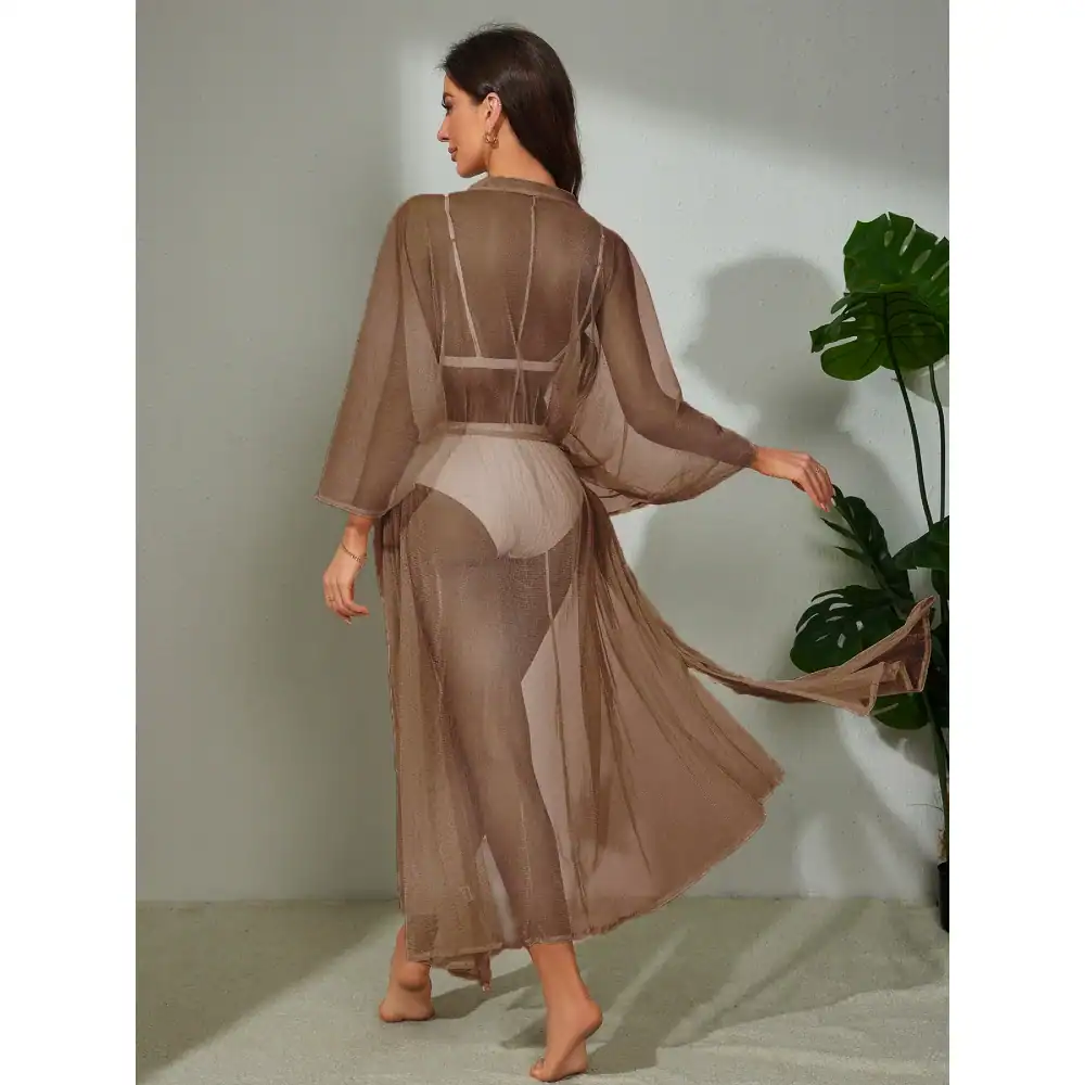 Luxurious women's sheer long kaftan perfect for resort wear, beach cover-up, or stylish casual look, featuring breathable lightweight fabric, flowy silhouette, and modern design.