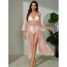 Beautiful woman modeling elegant beach cover-up with matching lingerie, stylish and breathable, perfect for summer vacations, pool days, or lounging at the beach or poolside.