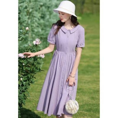 Stylish lavender dress with puff sleeves, collar detail, and a flowing midi length, ideal for spring and summer outings.