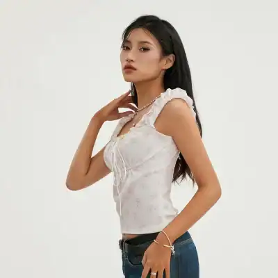 Elegant woman in a floral top showcasing modern glasses and optometry products available at Monalisa Store.