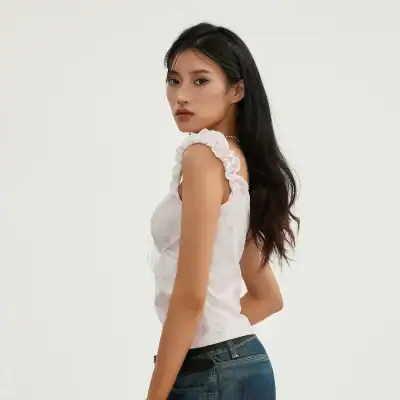 Elegant women's floral sleeveless top with ruffle shoulder accents, perfect for casual or chic outfits, available at Monalisa Store.