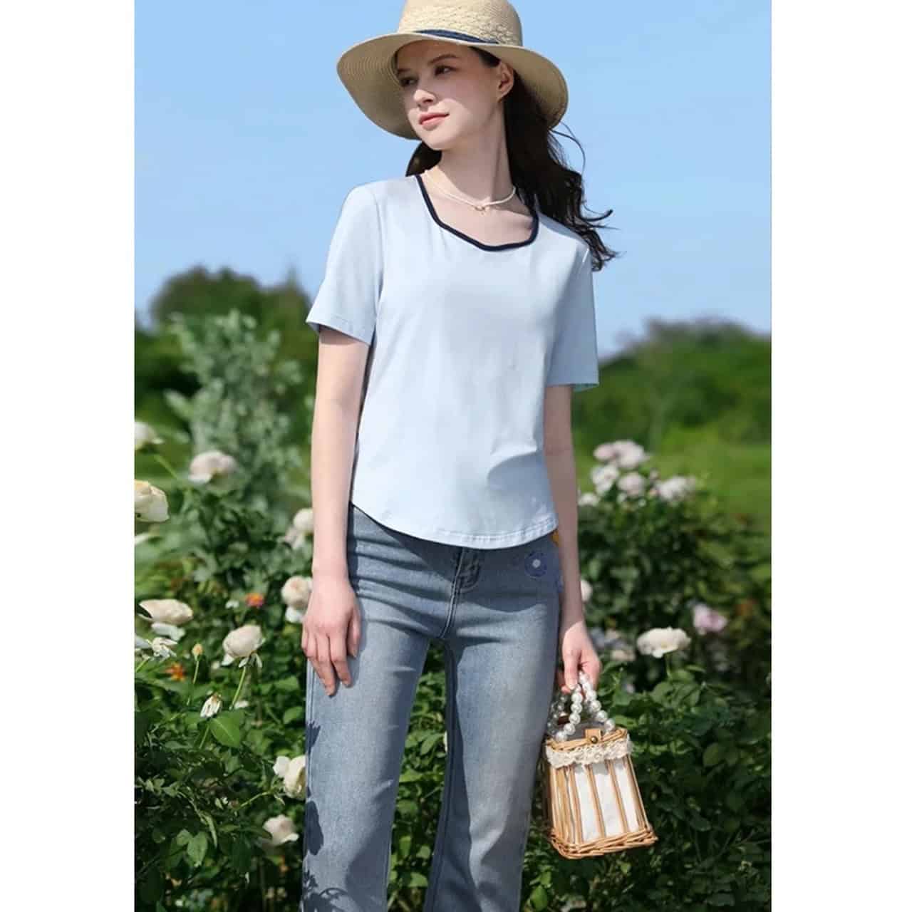 Elegant lightweight women's casual T-shirt with black trim, perfect for summer outings, urban fashion, and comfort.
