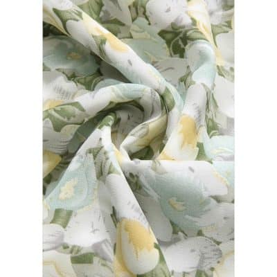 Soft, lightweight fabric with a beautiful floral print in yellow, green, and white hues for versatile styling.