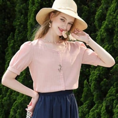 Bright pink stylish blouse with embroidery details, short sleeves, and buttons. Perfect for casual or semi-formal occasions, offering a comfortable fit and feminine design.