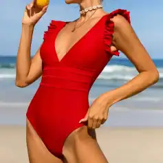 High-quality red one-piece swimsuit with ruffled shoulder details, perfect for beach and poolside fashion. Comfortable fit and vibrant color ideal for summer activities and swimwear fashion enthusiasts.