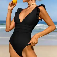 Stylish black swimsuit featuring ruffled shoulder accents, perfect for beachwear and swim fashion. Ideal for women seeking trendy, comfortable swimwear for summer vacations and pool days.