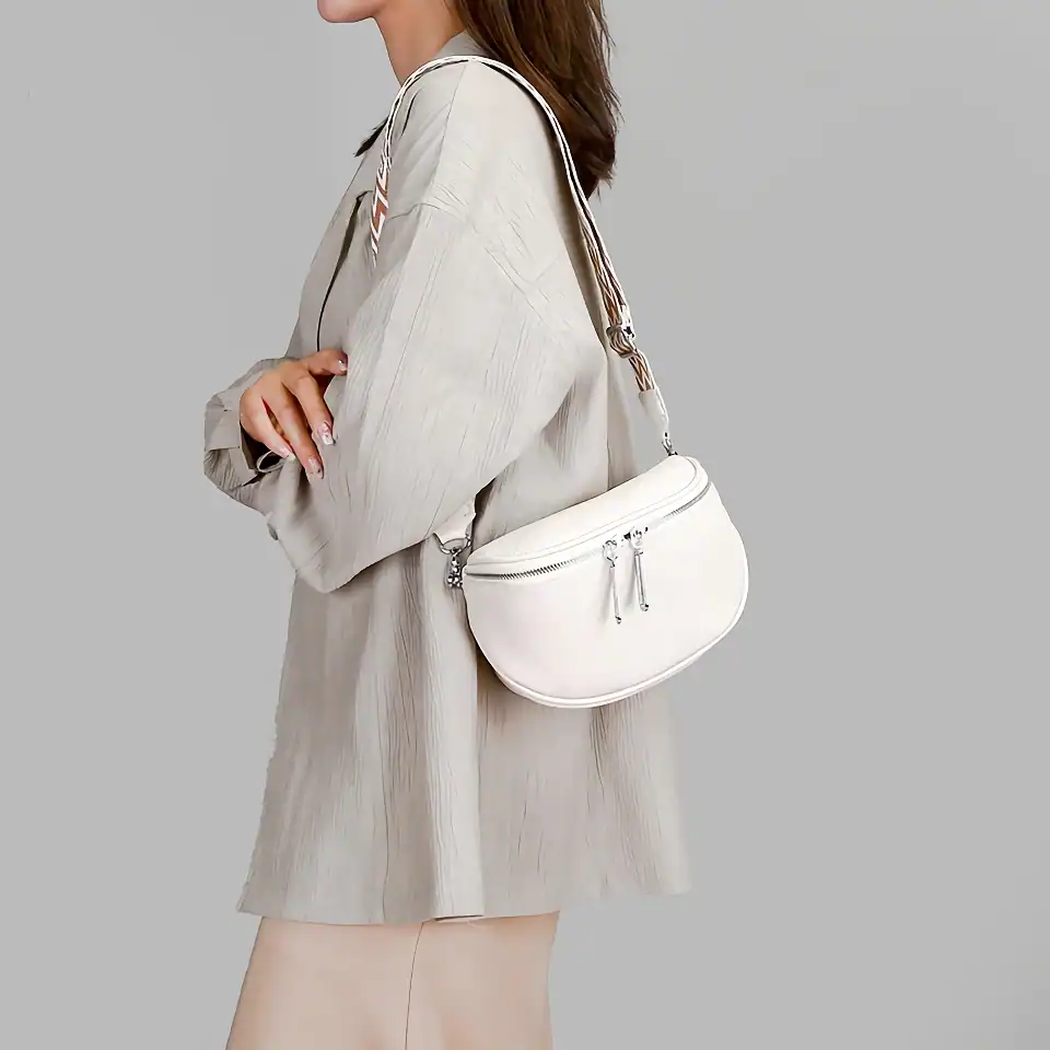 Stylish white crossbody bag with multiple zip compartments, perfect for daily use and fashion-forward outfits. Enhances your look while offering practical storage solutions.