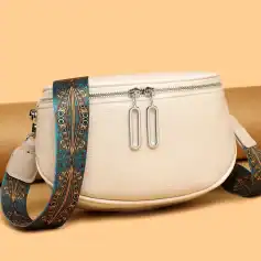 Elegant white designer bag for women with adjustable patterned strap.