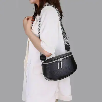 Stylish black leather bag with silver zippers, perfect for optical accessories and eyewear storage. Features a trendy black-and-white strap, great for purses and optical fashion.
