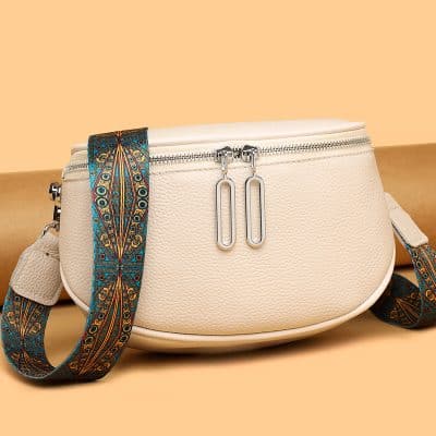 Elegant white leather optic bag with vibrant, patterned strap, functional zipper closure, and stylish design perfect for eyewear and accessories.
