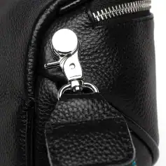 High-quality black leather handbag with silver hardware, durable zipper, and stylish design. Perfect for fashion-forward individuals seeking a premium accessory for daily use.