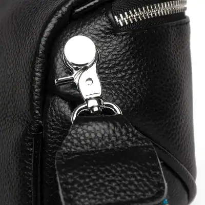 High-quality black leather handbag with silver hardware, durable zipper, and stylish design. Perfect for fashion-forward individuals seeking a premium accessory for daily use.