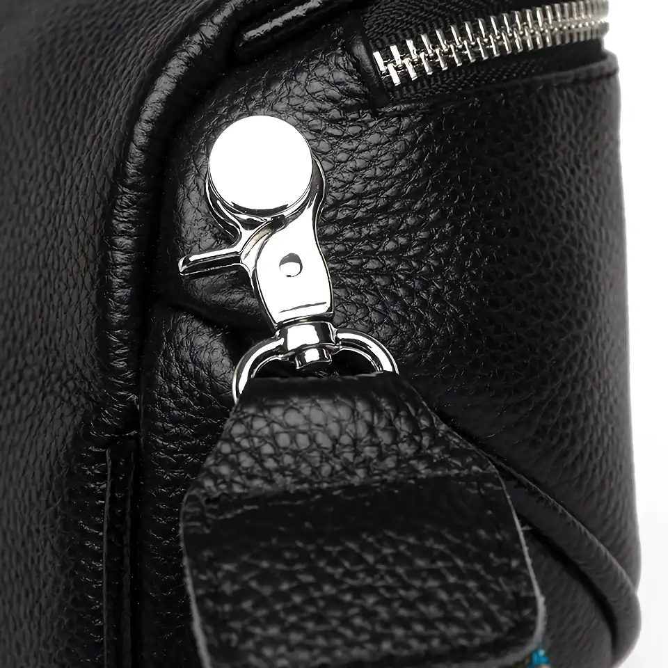 High-quality black leather handbag with silver hardware, durable zipper, and stylish design. Perfect for fashion-forward individuals seeking a premium accessory for daily use.