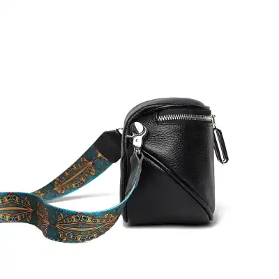 Stylish black leather crossbody bag with adjustable strap, perfect for everyday use and travel. Features multiple compartments, high-quality material, and elegant design, ideal for fashion-conscious individuals.