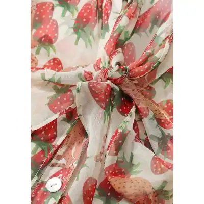 Lightweight strawberry patterned kimono with bow-tie front, perfect for casual or beachwear. Made from soft, breathable fabric, ideal for summer fashion and comfort.