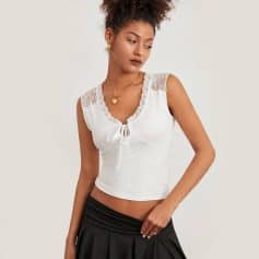 Stylish white sleeveless top with lace detail and front tie, perfect for casual or office wear, available at Monalisa Store, enhancing your wardrobe with trendy fashion pieces.
