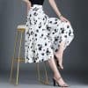 Stylish black and white floral midi skirt for women, perfect for fashion-forward outfits and everyday wear. Comfortable, trendy, and ideal for shopping or casual outings.