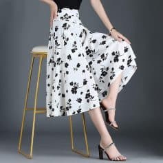 Stylish black and white floral midi skirt for women, perfect for fashion-forward outfits and everyday wear. Comfortable, trendy, and ideal for shopping or casual outings.