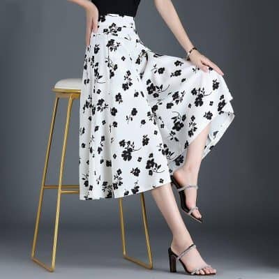 Stylish black and white floral midi skirt for women, perfect for fashion-forward outfits and everyday wear. Comfortable, trendy, and ideal for shopping or casual outings.