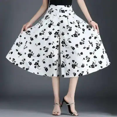 Stylish black and white floral midi skirt for women, perfect for fashion-forward outfits and versatile styling. Ideal for casual or semi-formal occasions.