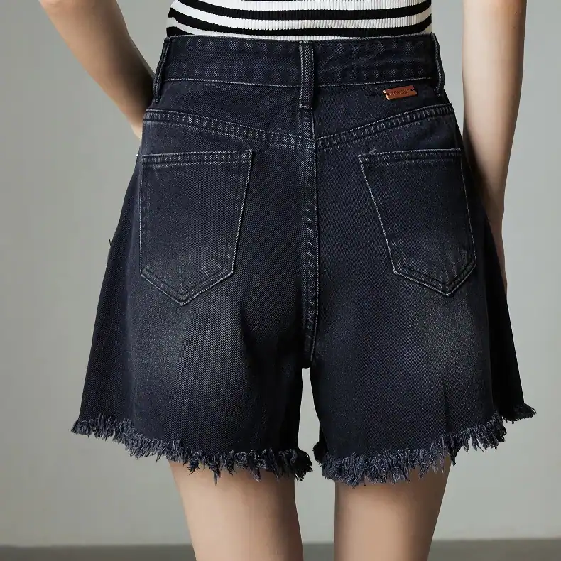 Comfortable high-waisted black denim shorts with frayed hem, perfect for summer fashion.