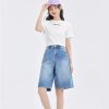 Comfortable high-waist denim shorts perfect for trendy summer fashion and casual wear. Suitable for women seeking fashionable, versatile shorts for outdoor activities.