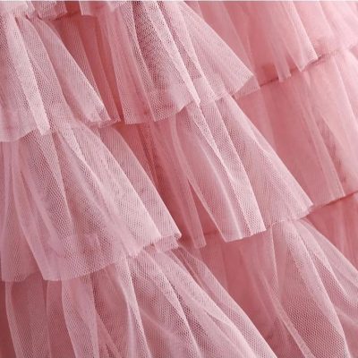 Elegant pink tulle dress for girls, perfect for special occasions and parties. Soft, layered fabric with a delicate, fashionable design that adds charm and grace.