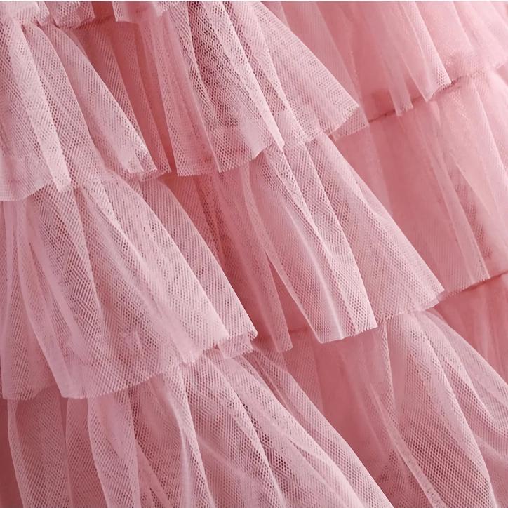 Elegant pink tulle dress for girls, perfect for special occasions and parties. Soft, layered fabric with a delicate, fashionable design that adds charm and grace.