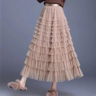Luxurious beige layered ruffle skirt for women, perfect for stylish, comfortable everyday wear or special occasions, showcasing classy and feminine fashion options.