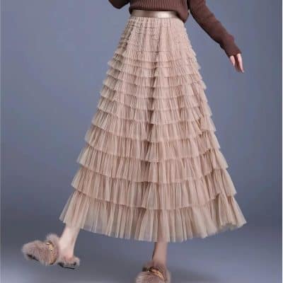 Stylish beige layered tulle ruffle skirt for women, perfect for fashion-forward looks, parties, and special occasions. Comfortable fit with trendy design, ideal for dressing up or casual wear.
