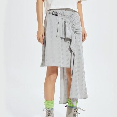 A stylish, contemporary skirt with unique asymmetrical design and adjustable belt, perfect for fashion-forward individuals. Features a versatile blend of comfort and trendy details for casual or chic outfits.