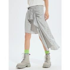 Elegant metallic skirt with asymmetrical drape for modern style.