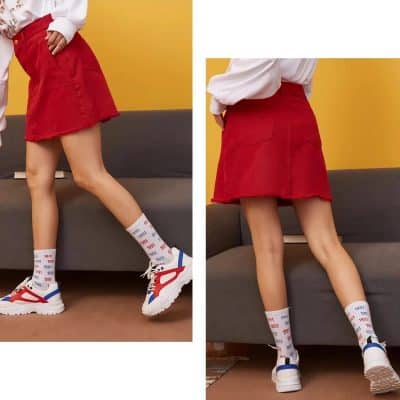 Stylish red women's skirt from Monalisa Store paired with sneakers and socks, ideal for chic casual looks. Discover trendy women's clothing options today.