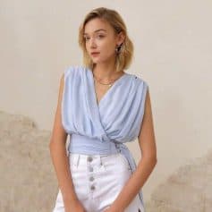 Stylish woman wearing chic optical accessories at Monalisa Store, showcasing fashionable glasses and eyewear options for modern vision needs.