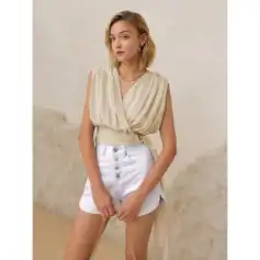 High-quality beige sleeveless draped blouse for women, stylish and comfortable for casual or office wear. Perfect for summer outfits and fashion-forward looks.