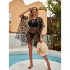 Stylish black mesh beach cover-up over swimwear for women, perfect for poolside lounging and beach days. Breathable, fashionable, and ideal for vacation wear.