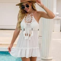 Stylish women’s white summer dress with crochet details, tassels, and breathable fabric, perfect for beachwear, vacations, and summer casual outings.