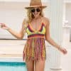 Stylish crochet beach dress perfect for summer vacations and poolside lounging. Features vibrant multicolor design with fringes, suitable for warm weather and beachwear fashion.