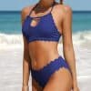 Stylish blue swimsuit for women, perfect for beach and pool outings, with scalloped edges and chic design.