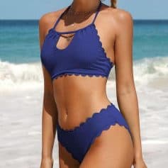 Stylish blue swimsuit for women, perfect for beach and pool outings, with scalloped edges and chic design.