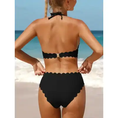 Black scalloped bikini top and high-waisted bottom, ideal for beach, swimming, and pool fashion. Perfect for summer vacations and seaside fun.