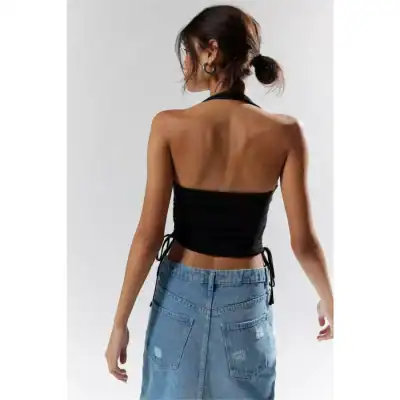 Stylish black halter top with open back, perfect for summer or casual outings. Comfortable fit with adjustable side ties, pairs well with jeans or skirts.