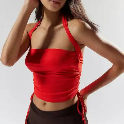 Close-up of a vibrant red halter top with ruched details, perfect for fashion-conscious women seeking trendy eyewear options at Monalisa Store.