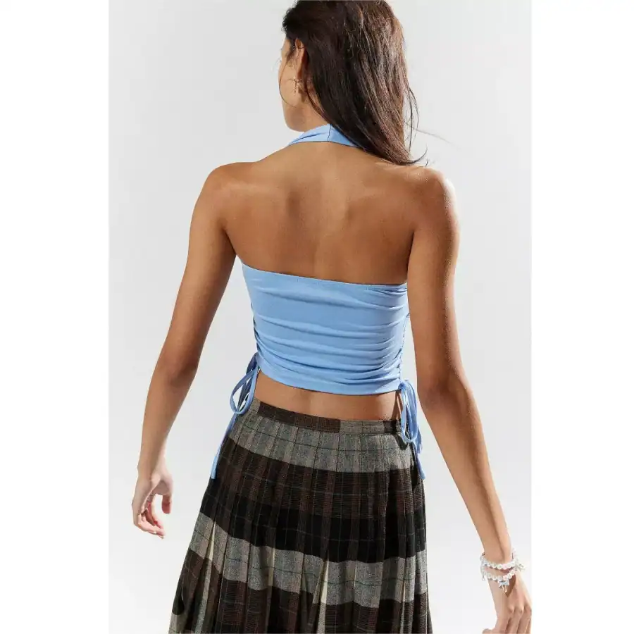 Stylish women's backless blue crop top with adjustable side ties, perfect for summer and casual wear. Made from comfortable, breathable fabric for a fashionable and trendy look.