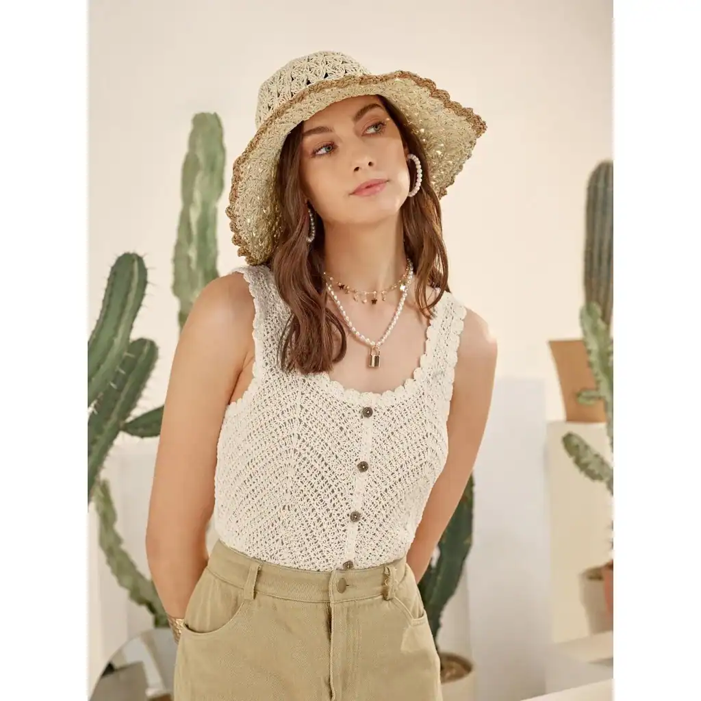 Stylish sun hat with wide brim, perfect for summer outdoor activities and fashion accessories.