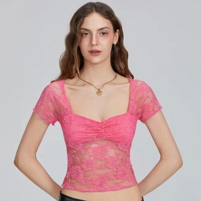 Elegant pink lace women's top with floral design, semi-sheer fabric, fitted style, perfect for fashion or special occasions.